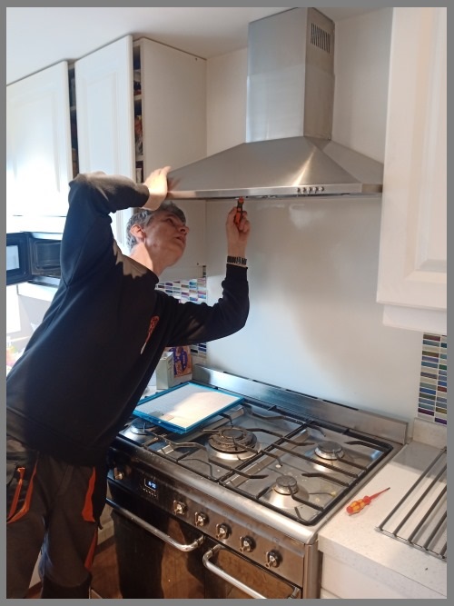 Kitchen hood installer in Bishop's Stortford preparing commercial extraction canopy